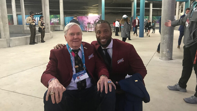 Raymond with Larry Fitzgerald.